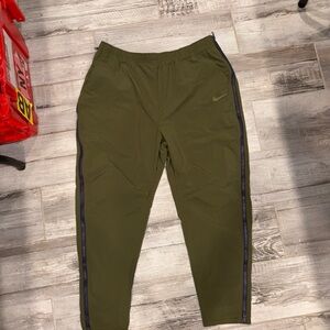 Nike Men's Olive Green Track Pants with side zippers to zip off XL